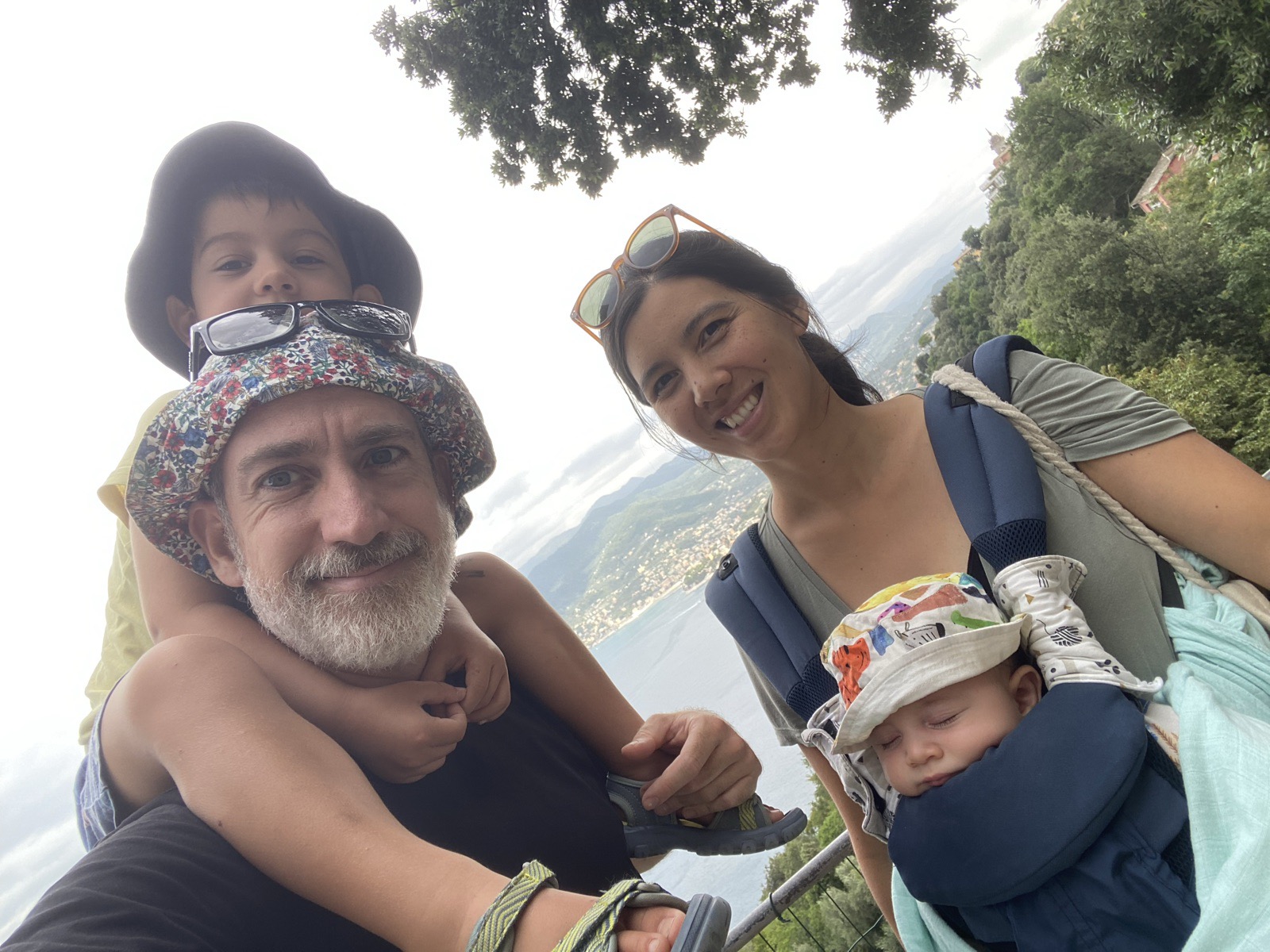 Family selfie above a coastline: Pierre and his wife with their two sons